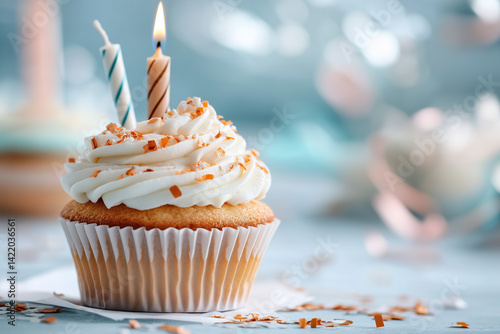 A single vanilla cupcake with smooth white frosting sits centered against a soft pastel background, such as pale peach or dusty blue