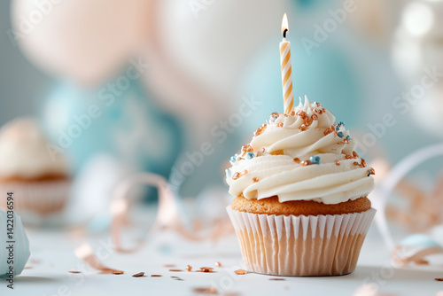 A single vanilla cupcake with smooth white frosting sits centered against a soft pastel background, such as pale peach or dusty blue