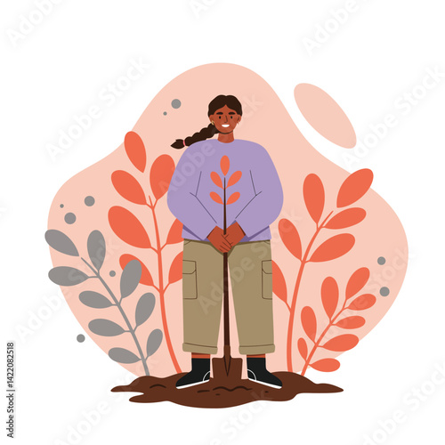 Woman planting young tree surrounded by orange and grey leaves in abstract nature background natural environment care and growth concept 