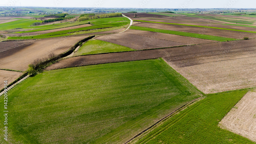 drone footage of rural farm fields in full color..