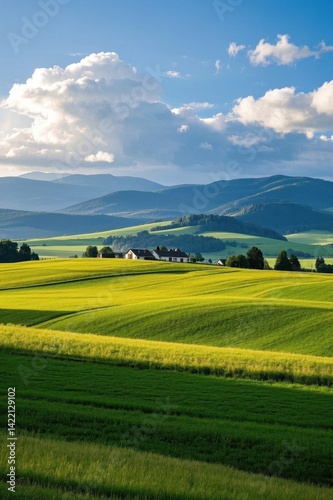 arafed view of a farm in a green field with mountains in the background