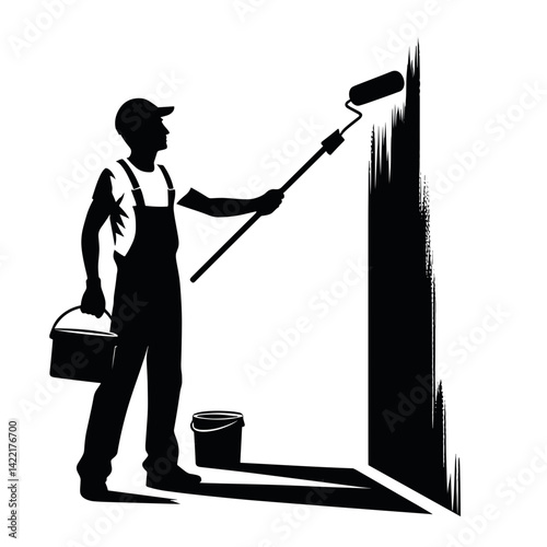 Painter applying paint on wall with roller  