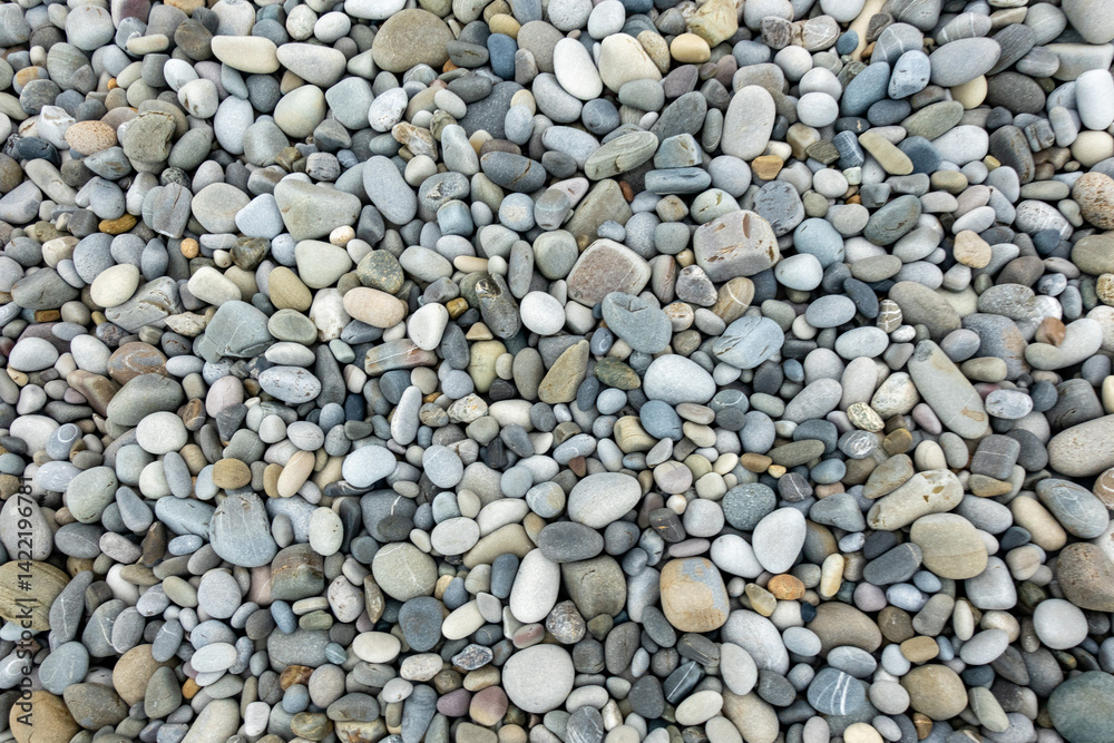 A pile of rocks with a single rock in the middle A pile of rocks with a single rock in the middle