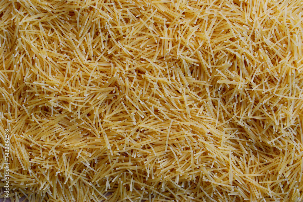 small vermicelli made from durum wheat scattered on the surface small vermicelli made from durum wheat scattered on the surface