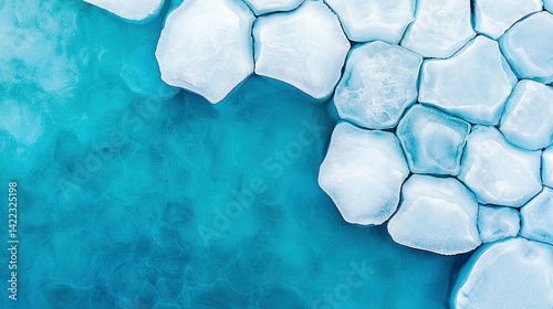 Obraz na płótnie An aerial view of icebergs floating in blue water surrounded by ice floes w salonie