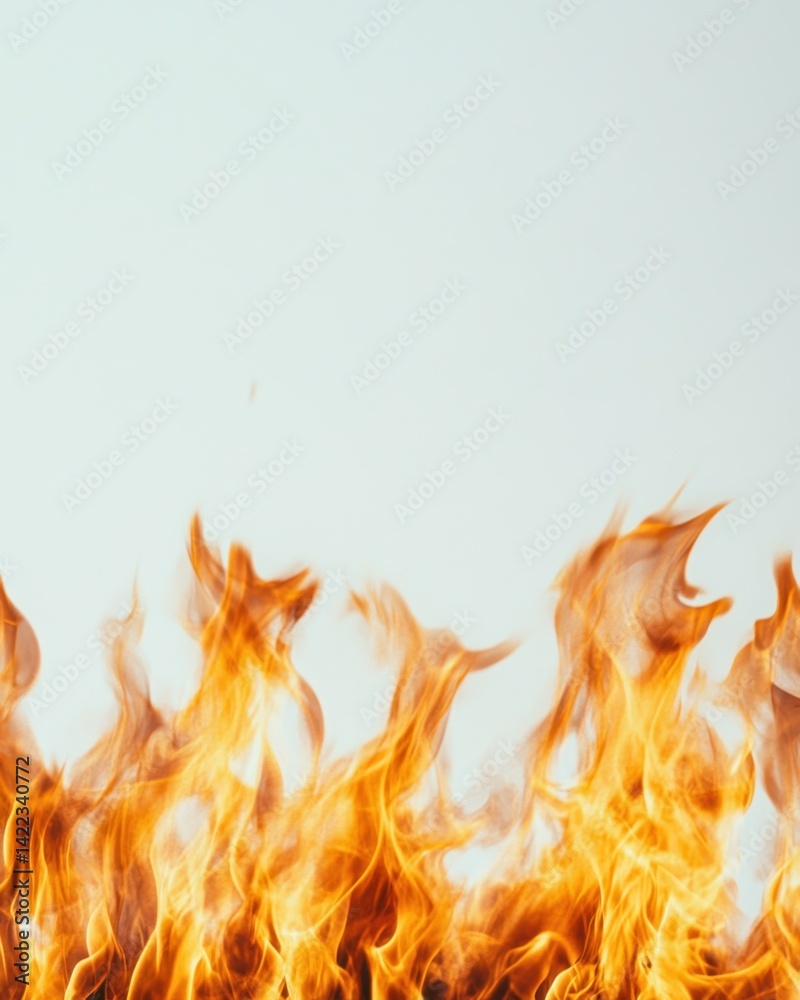 Fiery flames dance against a bright background creating a mesmerizing display of heat and energy in a captivating shot Fiery flames dance against a bright background creating a mesmerizing display of heat and energy in a captivating shot