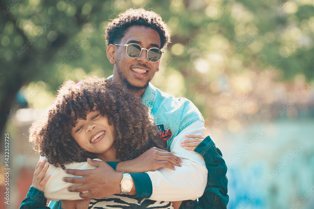 romantic latin couple hugging happily outdoors