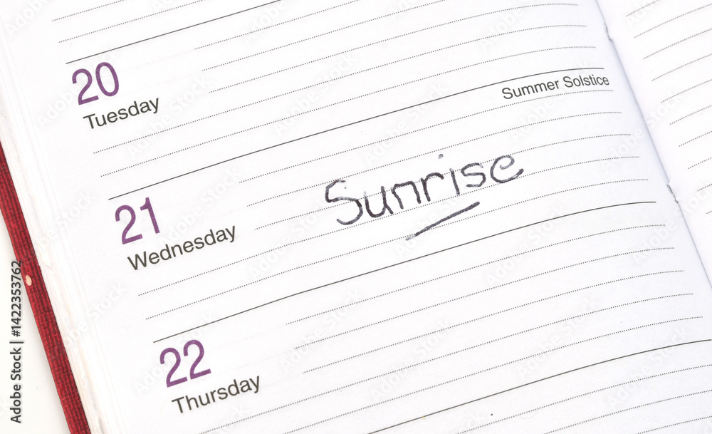 Close up view of the page of a pocket diary with the word Sunrsise written on the date of the Summer Solstice in the UK in June Close up view of the page of a pocket diary with the word Sunrsise written on the date of the Summer Solstice in the UK in June