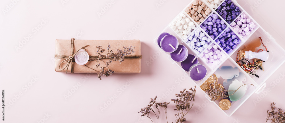 Gift in Kraft Paper with Wax Seal and Making Kit on Pink top view web banner