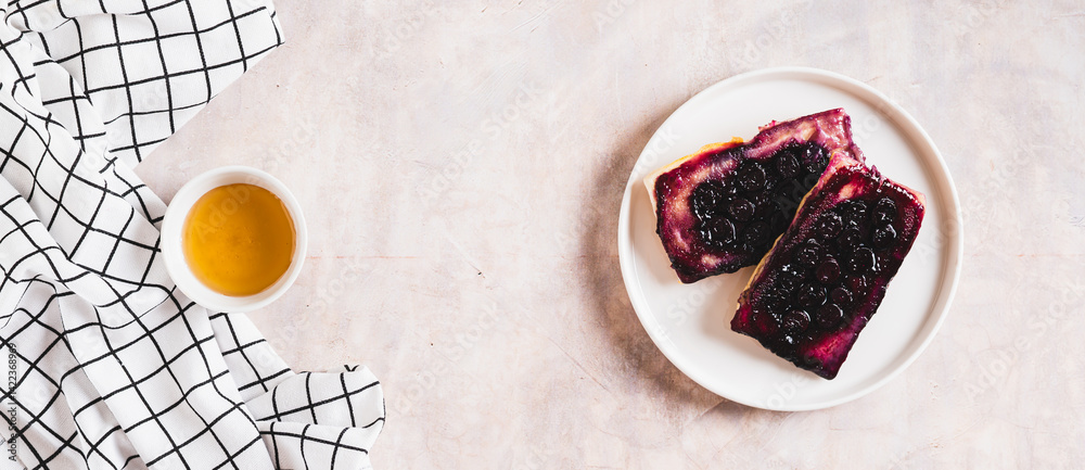 Delicious upside down berry pies on a plate on the table top view web banner