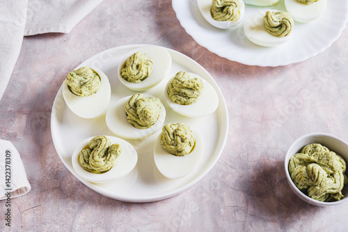Obraz na płótnie Avocado deviled eggs for appetizer on plate on table w salonie