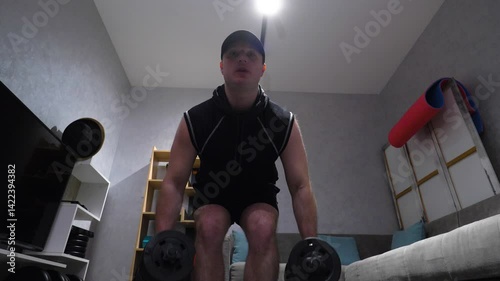 Men's Back Muscle Workout with Dumbbells in Hands, Workout at Home in Modern Apartments. Slow Motion.