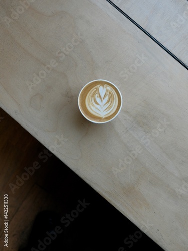 Specialty Coffee Latte Art on Wooden Counter 