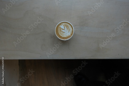 Specialty Coffee Latte Art on Wooden Counter 