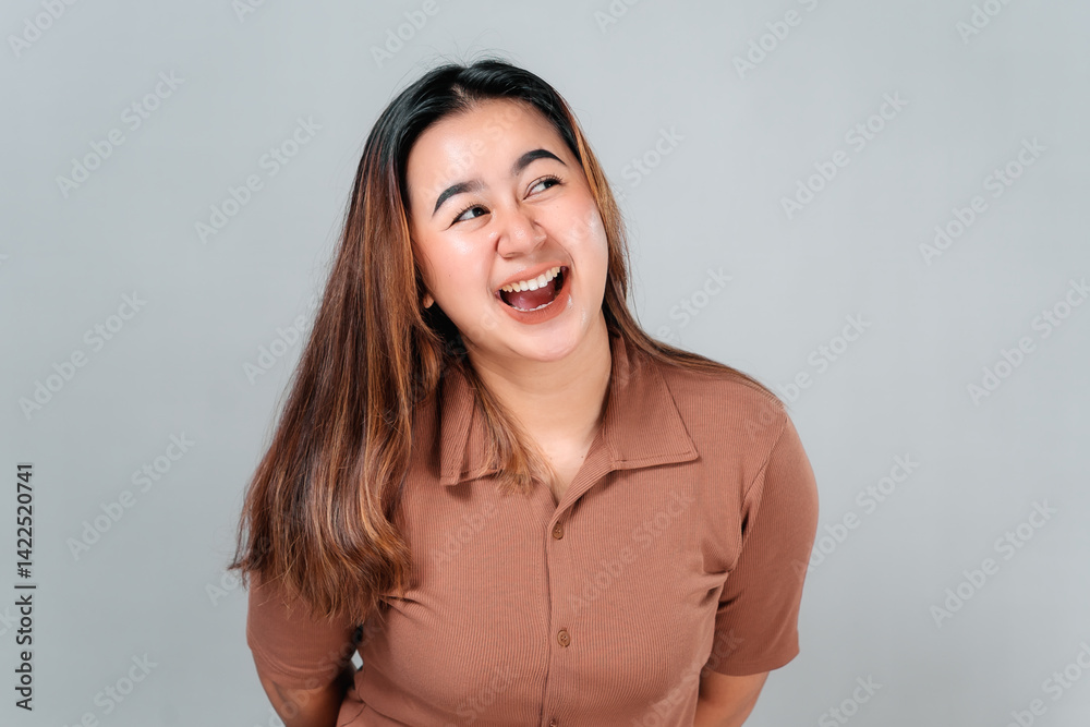 Happy young Asian woman smiling brightly and looking up with joyful eyes, expressing genuine excitement and warmth. Perfect for advertising, lifestyle, and emotional branding. Happy young Asian woman smiling brightly and looking up with joyful eyes, expressing genuine excitement and warmth. Perfect for advertising, lifestyle, and emotional branding.