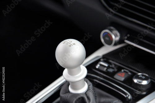 Shifter and center console of a Lotus at a car show
