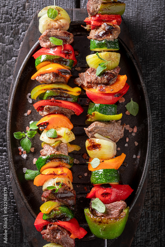Spicy grilled skewer with spices and herbs.