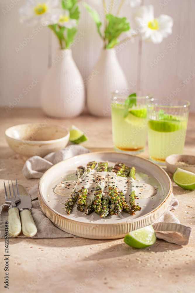 Hot roasted asparagus with sesame and lime.