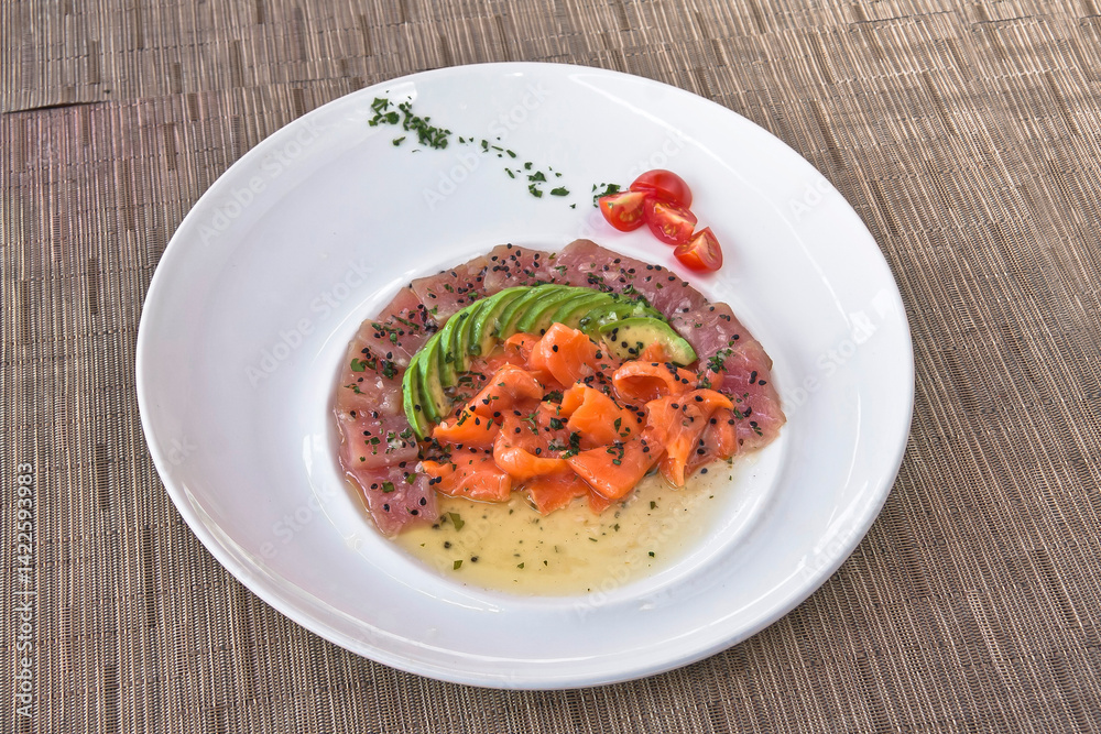 Tuna and salmon carpaccio with avocado and sesame seeds, salmon and tuna tiradito, food Tuna and salmon carpaccio with avocado and sesame seeds, salmon and tuna tiradito, food