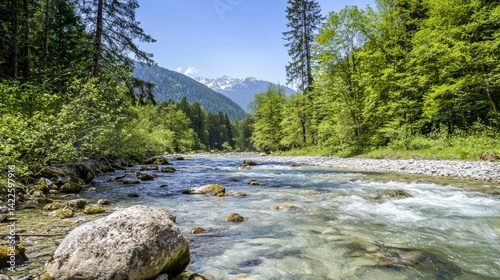 Pristine Mountain Landscape with Clear River Flowing Through Greenery