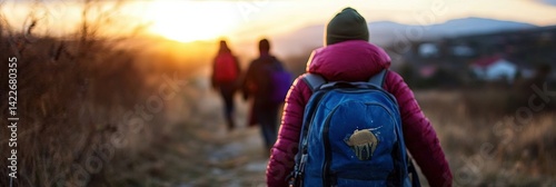 illegals crossing border for a better life - line of migrants with their personal belongings in a backpack