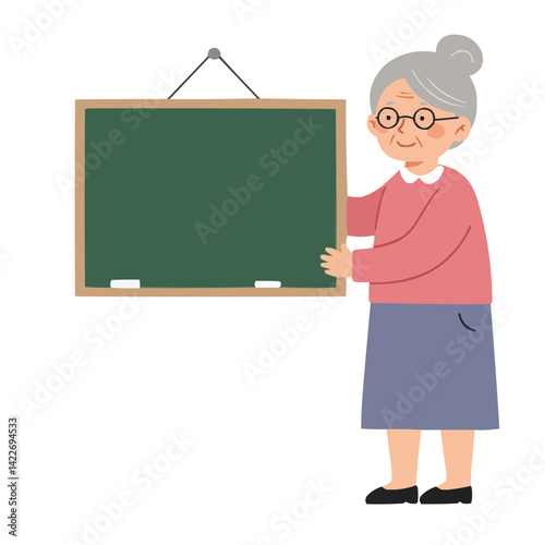 Elderly woman with chalkboard - senior teacher with warm smile writing on blackboard.