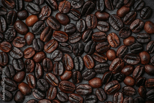 Coffee beans on the rustic background. Shot from above. Background and textures.