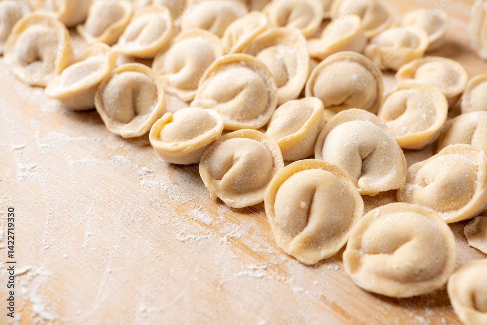 Raw dumplings in flour on the table. Russian national food. Selective focus. Raw dumplings in flour on the table. Russian national food. Selective focus.
