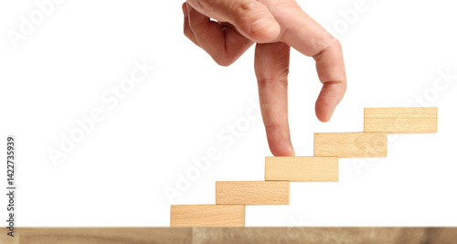 Creative hand reaching upward wooden blocks stacking minimalist design indoor setting close-up view concept of progress and growth