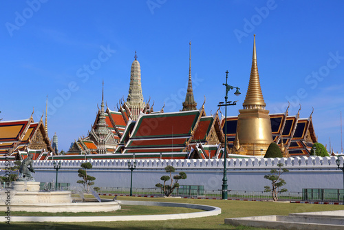 Grand Palace Complex with Golden Stupa Under Clear Blue Sky, Bangkok
