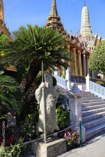 Stone Warrior Amidst Lush Gardens in Bangkok