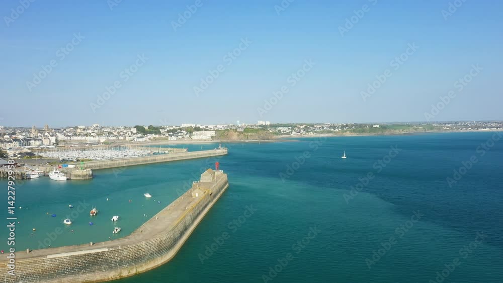 The bustling port of Granville facing the sea in Europe, France, Normandy, the English Channel, in spring, on a sunny day. The bustling port of Granville facing the sea in Europe, France, Normandy, the English Channel, in spring, on a sunny day.