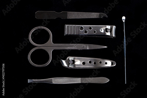 Obraz na płótnie Set of nail care tools for health and beauty isolated on black background. A set of tools for Manicure and pedicure care w salonie