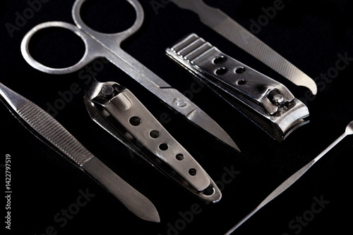 Obraz na płótnie Set of nail care tools for health and beauty isolated on black background. A set of tools for Manicure and pedicure care w salonie