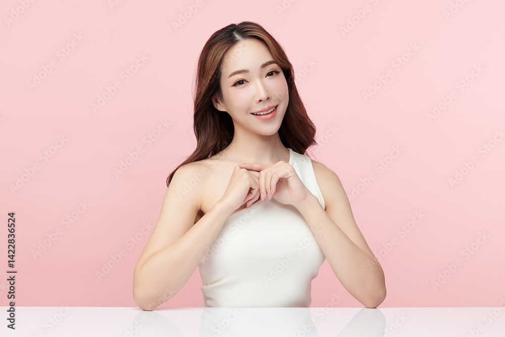 A beautiful young Asian woman with clean, fresh skin against a pink background. Skincare, facial treatment, cosmetology, beauty, and spa. An elegant portrait of an Asian woman. A beautiful young Asian woman with clean, fresh skin against a pink background. Skincare, facial treatment, cosmetology, beauty, and spa. An elegant portrait of an Asian woman.