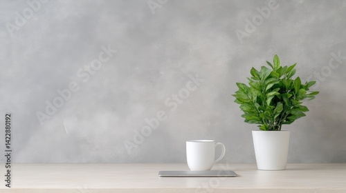 Wallpaper Mural Minimalist workspace with a plant and coffee cup.  Simple, modern aesthetic on a light wooden surface Torontodigital.ca