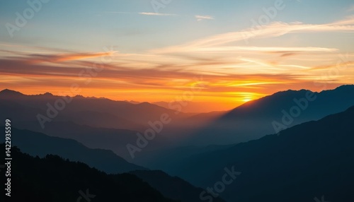 Majestic mountain range at golden hour, with layered peaks and vibrant skies