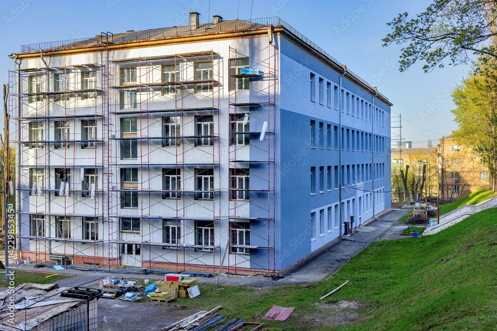 Renovation project enhances historic building exterior in vibrant spring atmosphere