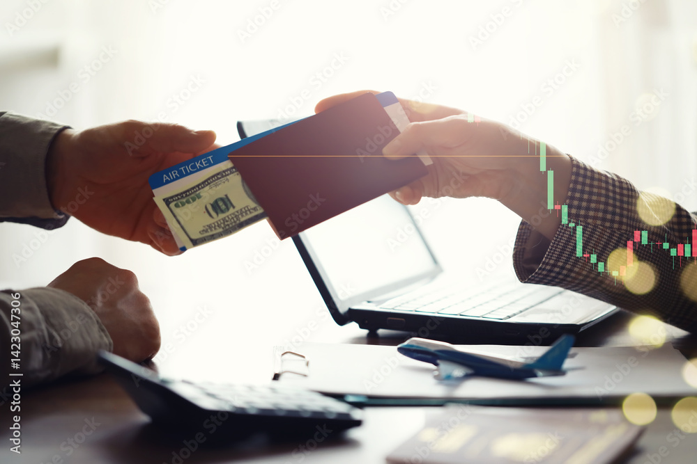 A man buys plane tickets from an agency. The client receives a passport with plane tickets from the travel agent.