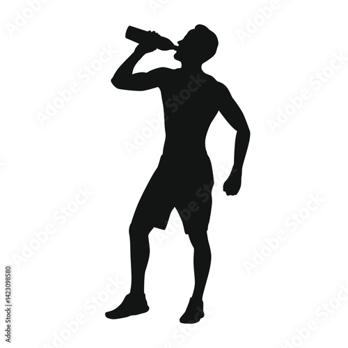 Silhouette of a man drinking water from a bottle