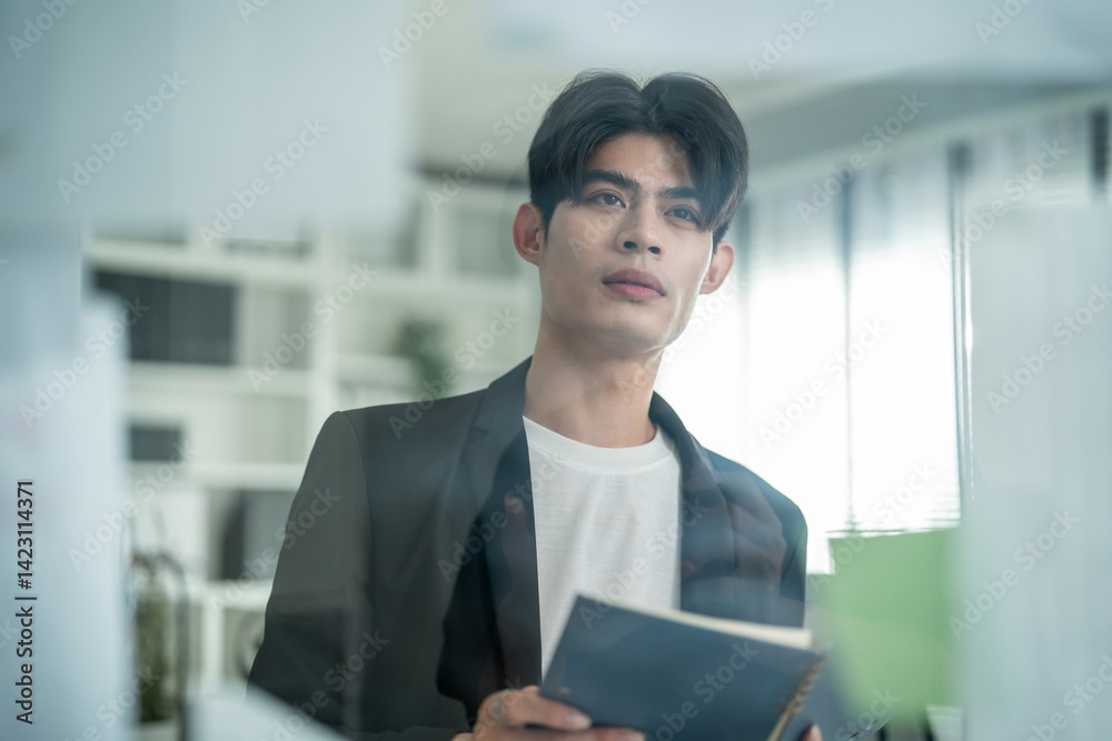 Asian young businessman working in conference room at the modern office. Asian young businessman working in conference room at the modern office.