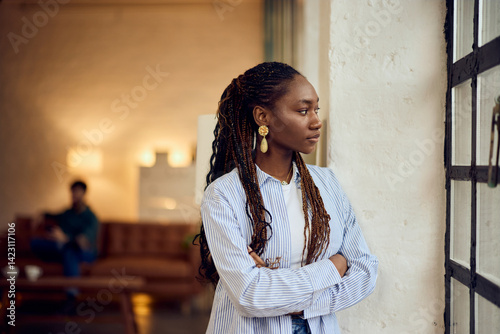 Obraz na plátně Young Woman Reflecting By Window in Stylish Modern Interior