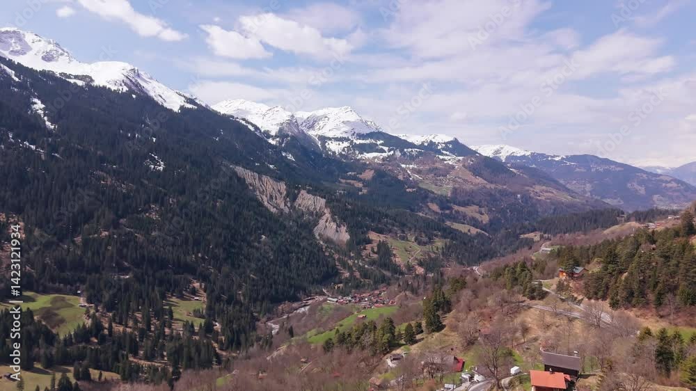Snow-capped mountains and green valley in peist, switzerland, aerial view Snow-capped mountains and green valley in peist, switzerland, aerial view