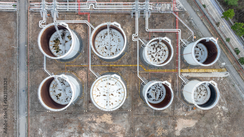 Oil terminal industrial facility storage tank, Oil storage tank with oil terminal port loading arm cargo oil product tanker ship, Global business refinery industry commercial port.