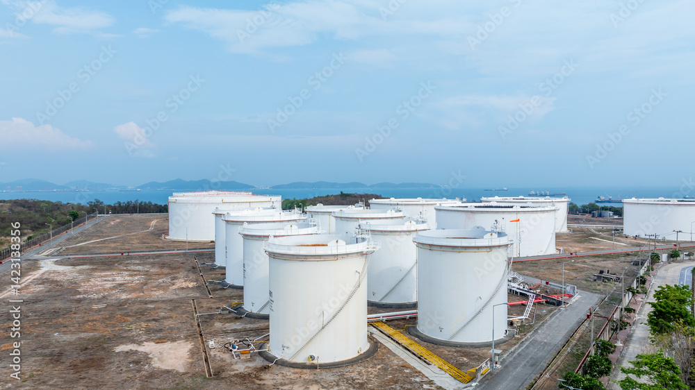 Oil terminal industrial facility storage tank, Oil storage tank with oil terminal port loading arm cargo oil product tanker ship, Global business refinery industry commercial port.