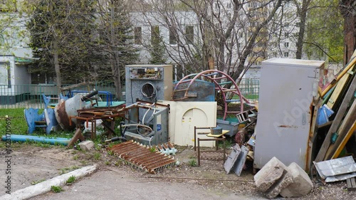 Old Unwanted Household Furniture and other things Dumped for Curbside Pickup by City Garbage Collection Cleaning Services. waste in dump yard. landfill facility of household items. 4 k video
