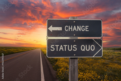 Road sign at sunset shows diverging paths: 