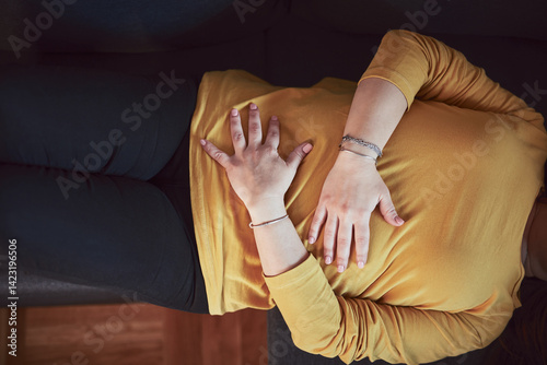Obraz na płótnie Woman with strong stomach ache, menstrual and digestive issues at home. w salonie