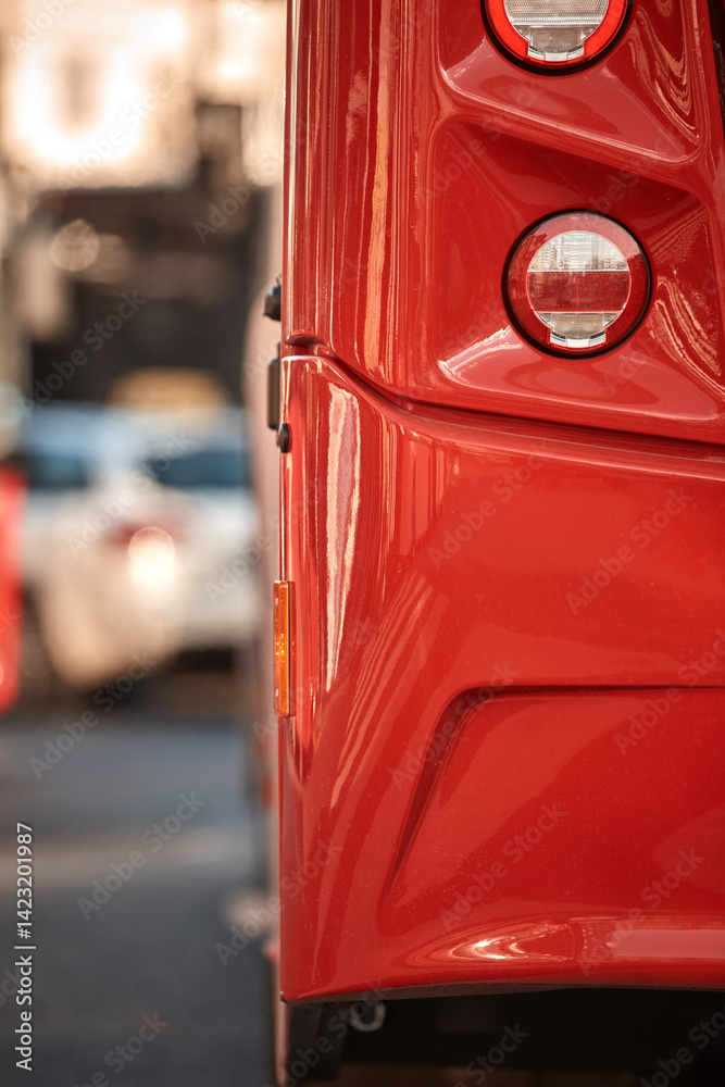 Red bus for public transportation parked on a station.