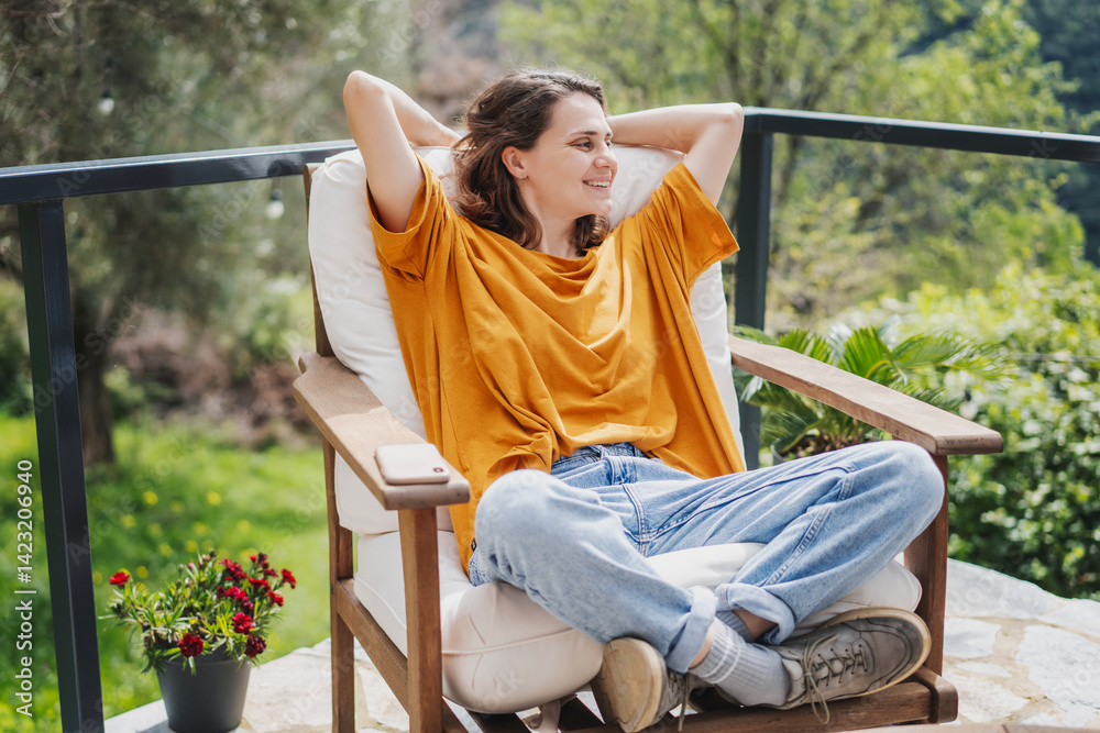 Young woman enjoying nature view from terrace
